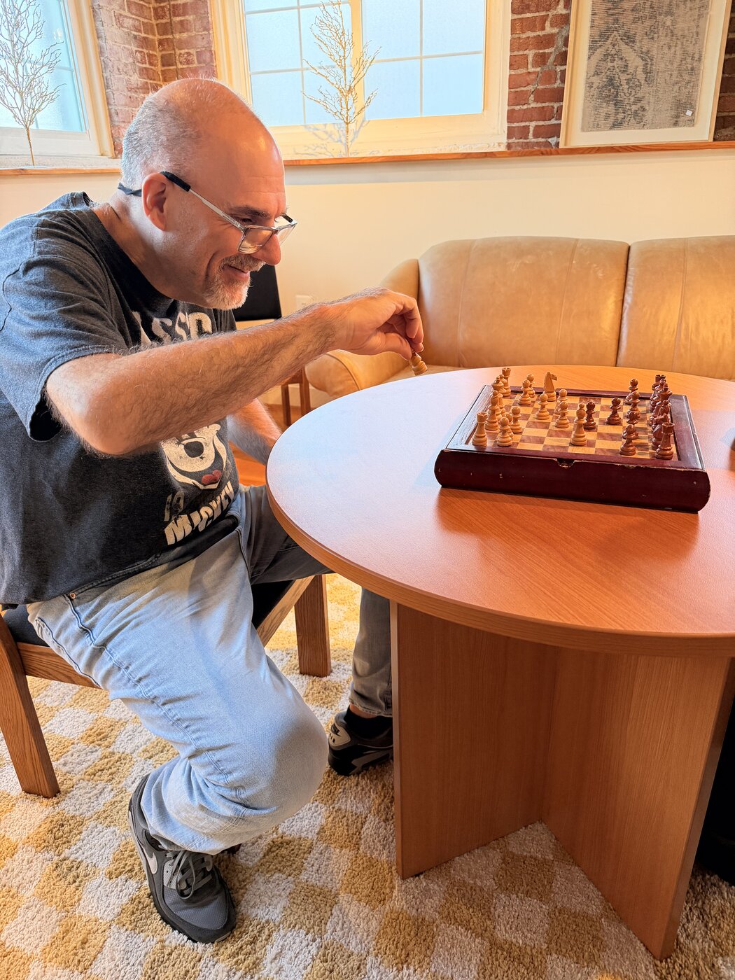 Jim enjoying a game of chess at Clubhouse Living